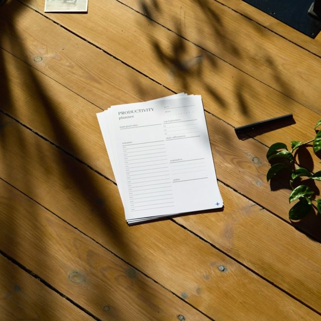a piece of paper sitting on top of a wooden table